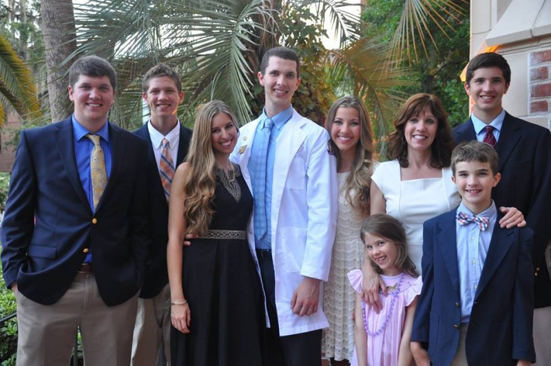 Lisa and her family celebrating with her oldest son at his White Coat Ceremony.